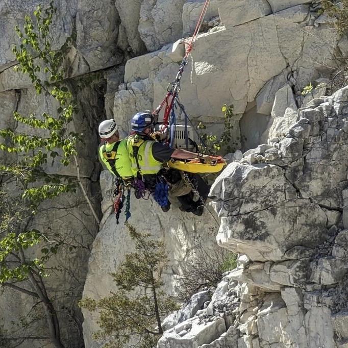 Rope team rappels down into a rock quarry to rescue a mutt named Rippy
